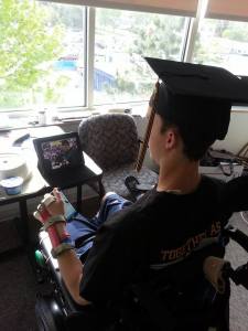 Courtesy: Alex's  Angels facebook page. Alex participates live via iChat in the Blue Valley H.S. Senior Class assembly.