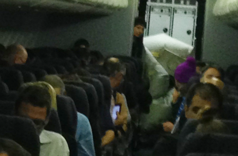 Slide opens during United flight on June 29, 2014.