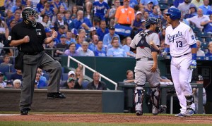 Home plate umpire Gary Cederstrom calls the Kansas City Royals' Salvador Perez (13) out looking at strike three as Minnesota Twins catcher Kurt Suzuki heads for the dugout at the end of the fourth inning on Thursday, July 2, 2015, at Kauffman Stadium in Kansas City, Mo. (John Sleezer/Kansas City Star/TNS via Getty Images)