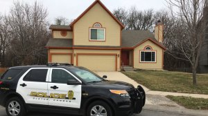 olathe-police-in-front-of-house